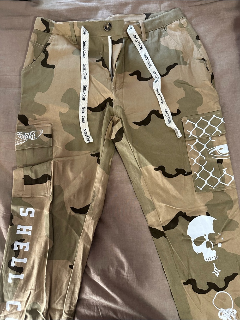 Shellcorp mens Camo Cargo Pants with White Skull and Graphic Accents